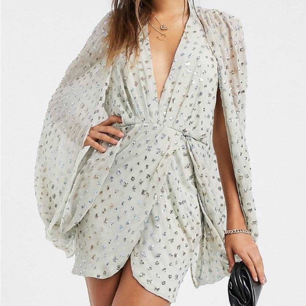ASOS DESIGN sequin embellished cape sleeve mini dress with wrap skirt